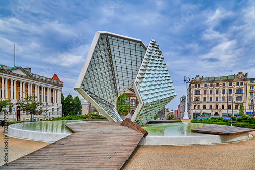 Freedom Fountain on Freedom Square in Poznan city, the fountain was added to the square in 2012. Behind is the old Raczynski Library built in the early 1800s, Poznan, Europe, Poland