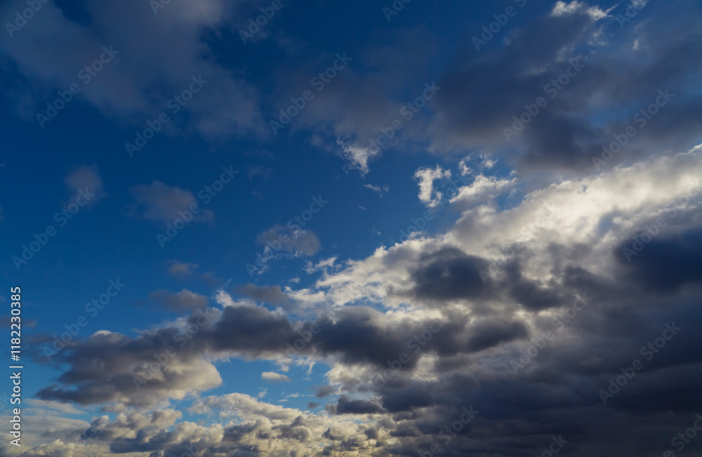 Gray-white clouds create a mysterious pattern on the twilight sky. Gray-white clouds create a mysterious pattern on the twilight sky.