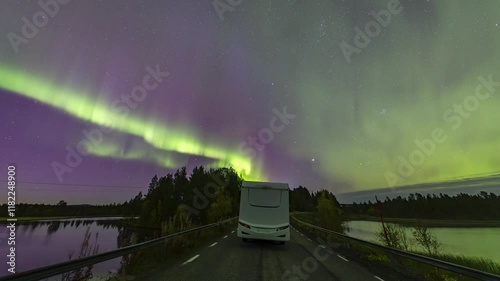 Camper van driving under northern lights timelapse near Kiruna, Sweden