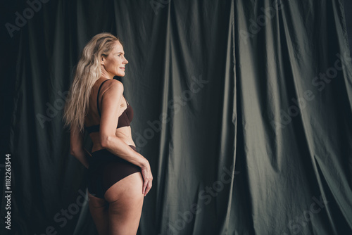 Studio no retouch photo of adorable gorgeous lady dressed lingerie accepting natural ageing isolated khaki linen background