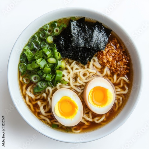 A vibrant bowl of ramen showcases tender noodles, rich broth, and glossy soft-boiled eggs, complemented by fresh green onions and seaweed, all against a clean white backdrop photo