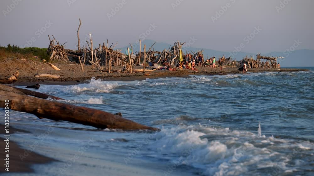 Houses built with wooden logs on the beach at sunset. Romantic moments. Slow motion 4K Houses built with wooden logs on the beach at sunset. Romantic moments. Slow motion 4K