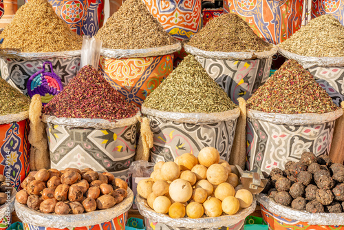 Fototapeta Naklejka Na Ścianę i Meble -  Different colorful spices in baskets on the shelves.