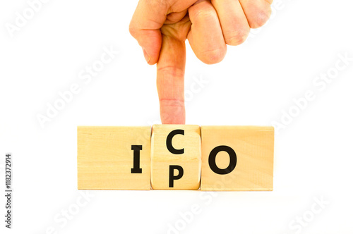 Initial public or coin offering symbol. Concept words abbreviation IPO or ICO on wooden block. Beautiful white table white background. Business Initial public or coin offering concept. Copy space. photo