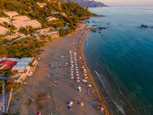 Aerial drone view over Pelekas Kontogialos beach at sunset. Corfu, Greece. photo