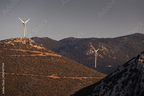 Obraz na płótnie Wind turbines on the hills of Greece. Industrial concept photo for wind mills that produce electricity from wind power. Wind turbines on Parnassus mountain hills in Greece. Green energy. w salonie