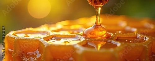 Dripping honey from the top of a hexagonal honeycomb, golden nectar, honeycomb photo