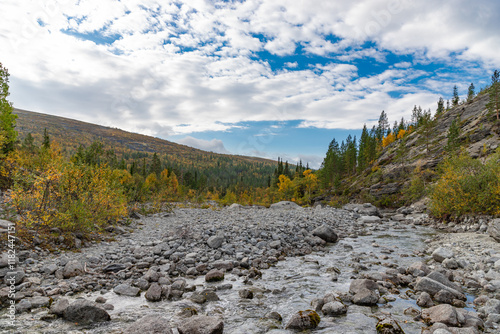 Obraz na płótnie View to Mannepakhp river at Khibiny mountains. Early autumn in arctic tundra region. Kola peninsula, Murmansk region, Russia. w salonie