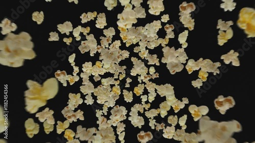 Popcorn flies on black background
