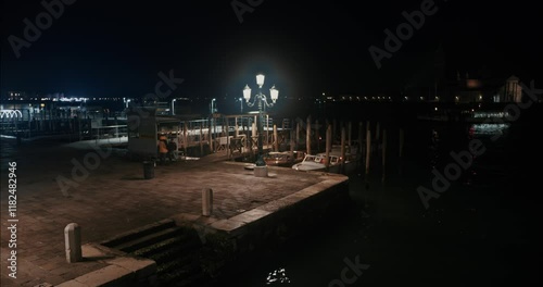 Water taxi station in Venice during a cold winter night photo