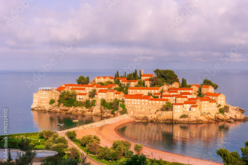 panoramic landscape of sea island sunrise or sunset with beautiful orange roofs and buildings, sea gulf water and scrnic colorful morning cloudy sky on background