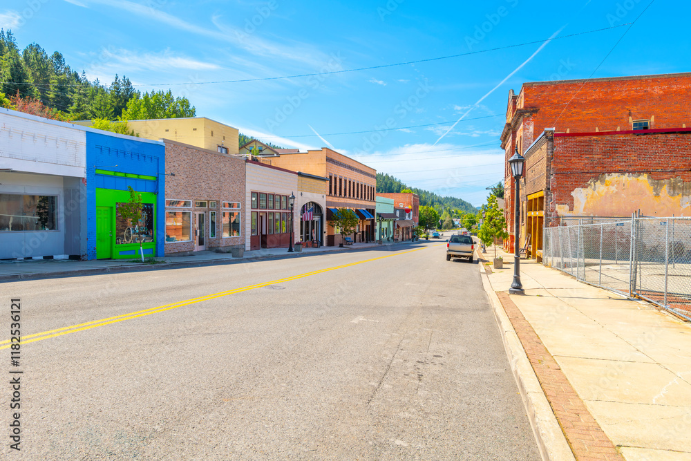 Naklejka premium McKinley Avenue, the main street through historic Kellogg Idaho in the Silver Valley district. Once a booming mining town, now a popular ski resort, August 19 2024. 