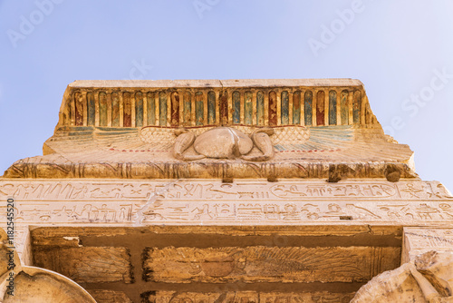 Kom Ombo, Aswan, Egypt. Upward view of a painted eave at the Kom Ombo temple. photo