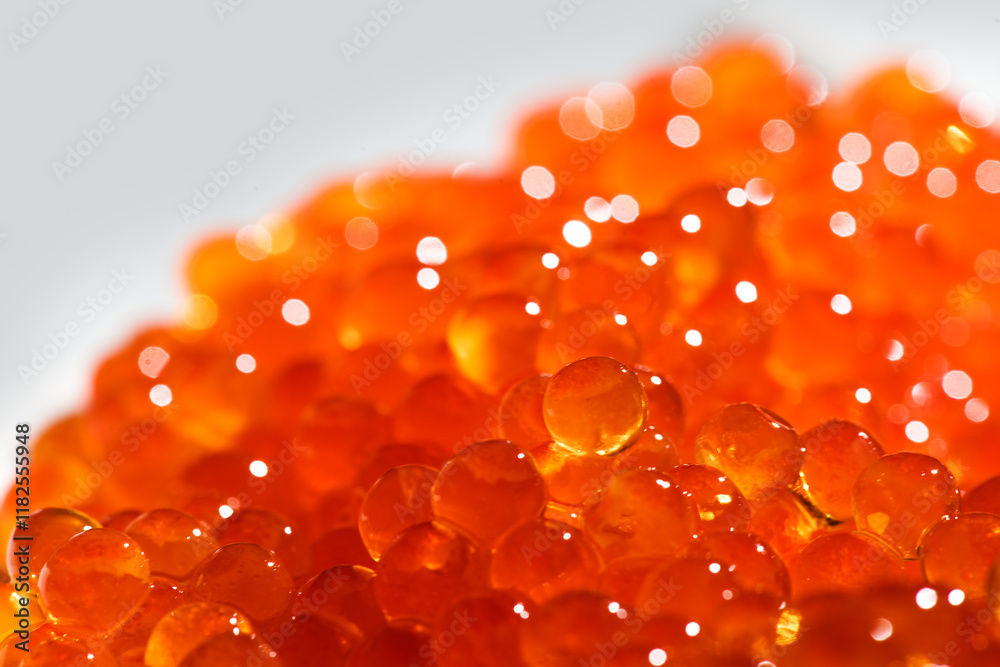 Red caviar background texture close up. Salmon caviar backdrop. Delicious gourmet food. Delicatessen. Texture of caviar. Seafood, macro shot, border design. Red caviar background texture close up. Salmon caviar backdrop. Delicious gourmet food. Delicatessen. Texture of caviar. Seafood, macro shot, border design.