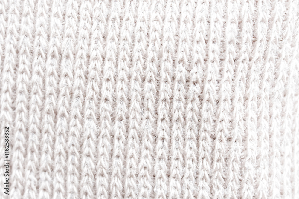 Textured white knit fabric showcases intricate weaving patterns and soft fibers suitable for cozy apparel and home textiles. Photo Textured white knit fabric showcases intricate weaving patterns and soft fibers suitable for cozy apparel and home textiles. Photo