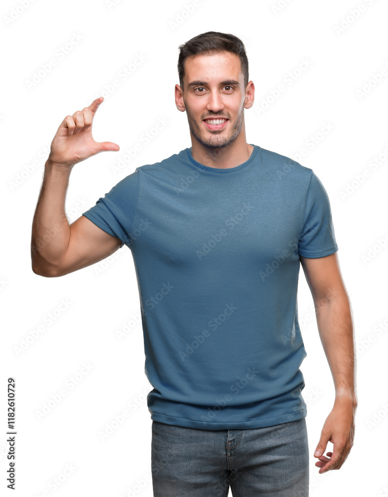 Handsome young casual man smiling and confident gesturing with hand doing size sign with fingers while looking and the camera. Measure concept. Handsome young casual man smiling and confident gesturing with hand doing size sign with fingers while looking and the camera. Measure concept.