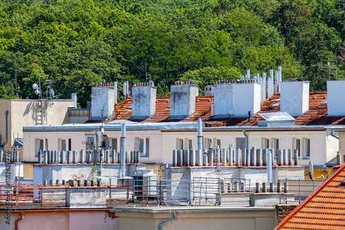 terraces and chimneys on the roofs in the neighborhood of Prague 5