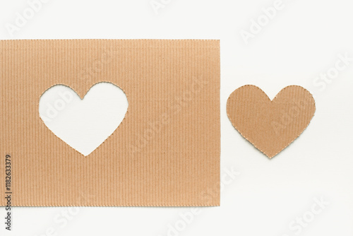 Cardboard heart. Cut out heart on cardboard. Valentine's Day background. February 14. Heart on a white background.
