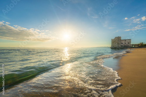 Torre Mozza beach and an old building on the sea. Follonica, Italy photo