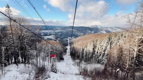 Beautiful snowy mountain landscape seen from a ski lift on a bright winter day