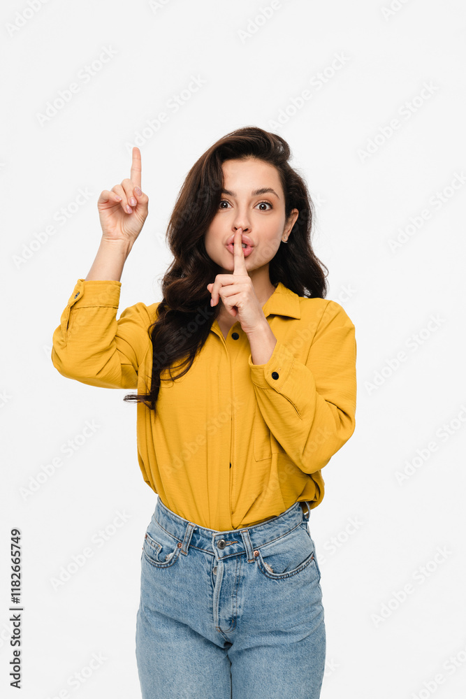 Vertical shot of attractive young woman lady sale manager showing indicate pointing up on empty copy space for advertisement, holding finger on lips mouth keep it quiet secret information isolated Vertical shot of attractive young woman lady sale manager showing indicate pointing up on empty copy space for advertisement, holding finger on lips mouth keep it quiet secret information isolated