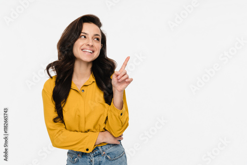 Photo of pretty sales manager young woman lady self-confident person indicating finger empty space wear casual shirt and jeans isolated white color background. Advertising concept photo