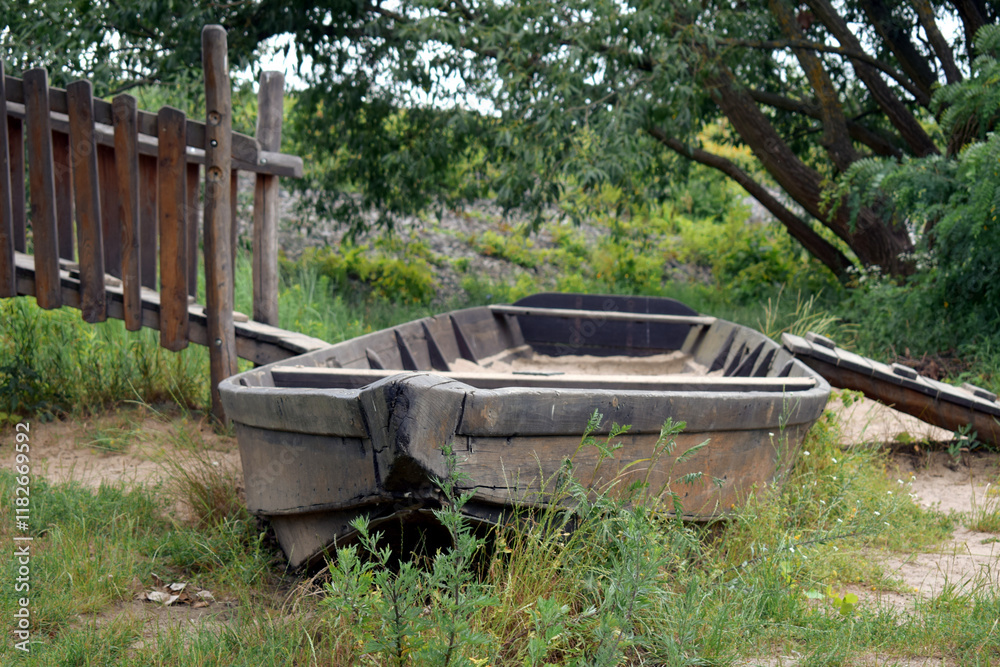 old wooden boats lined up on the river bank old wooden boats lined up on the river bank
