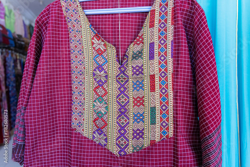 Djerba, Medenine, Tunisia. Traditional women's dress for sale at the Houmt Souk. photo