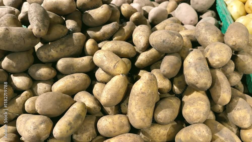 Potatoes piled high, a supermarket display of fresh produce Potatoes piled high, a supermarket display of fresh produce