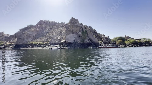 Traveling by cab boat from Aswan to Philae, with views of the Nile River and the Elephantine Islands of Egypt. Enjoy the breathtaking Egyptian views.
