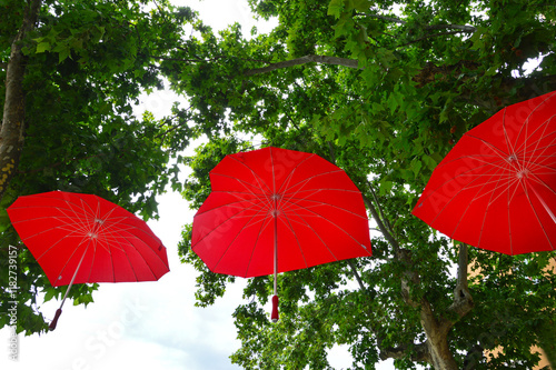 Three red umbrellas