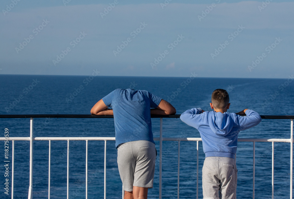 Two young man is looking from the coastal landscape Two young man is looking from the coastal landscape