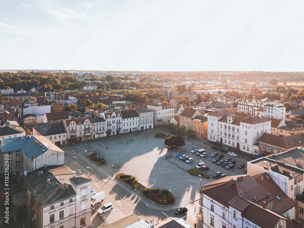 Obraz premium Summer aerial skyline cityscape of Town Square and Town Hall in Śrem (Rynek Miejski i Urząd Miejski w Śremie). Wielkopolska, Poland at sunset