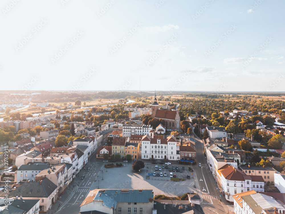 Summer aerial skyline cityscape of Town Square and Town Hall in Śrem (Rynek Miejski i Urząd Miejski w Śremie). Wielkopolska, Poland at sunset