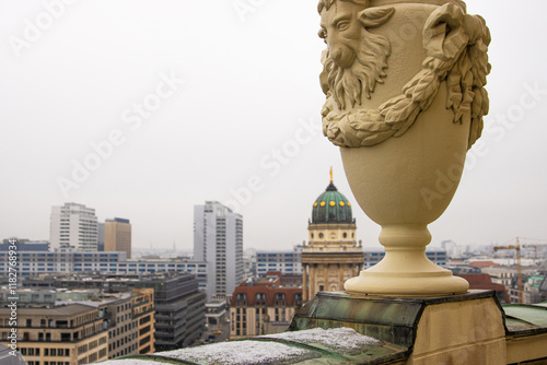 Berlin skyline with historical New German Catherdral and modern buildigs. Panoramic view of foggy Berlin from the rooftop of French Church on a misty day.  Selective focus. Copy space 
 photo