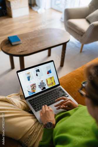 A woman uses a laptop at home