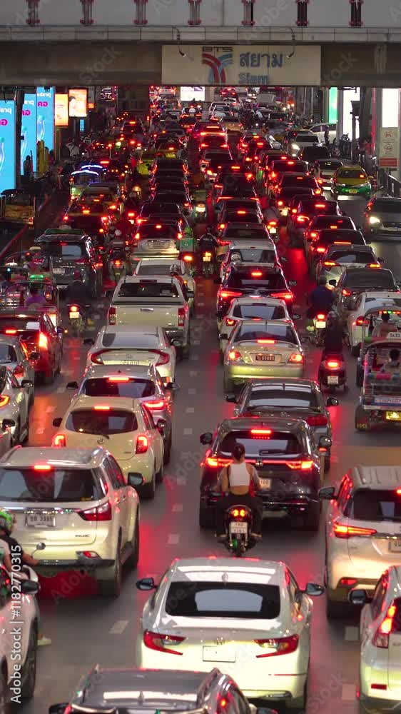 Busy traffic congestion in the city at night with bright lights and vehicles Busy traffic congestion in the city at night with bright lights and vehicles
