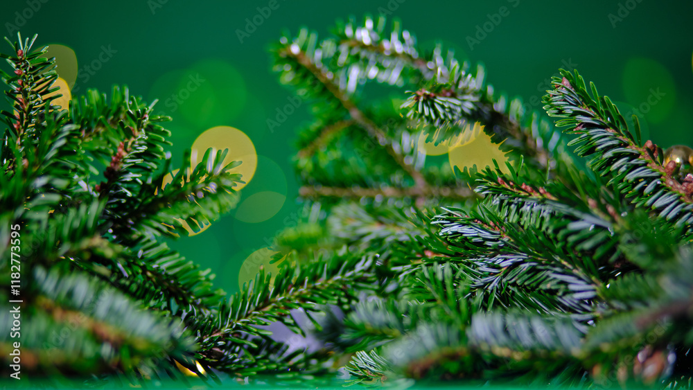 Fototapeta premium Lush evergreen branches enveloping a scene of soft, glowing bokeh lights create a visually stunning depiction of holiday warmth and joyful celebration.