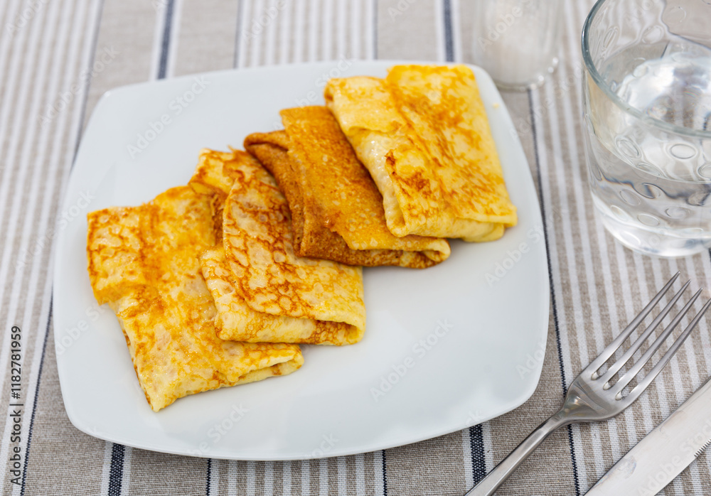 Delicious pancakes stuffed with liver and egg served on platter for breakfast Delicious pancakes stuffed with liver and egg served on platter for breakfast