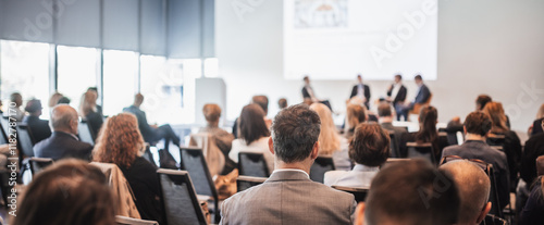 Interview and round table discussion at business convention and presentation. Audience at the conference hall. Business and entrepreneurship symposium.