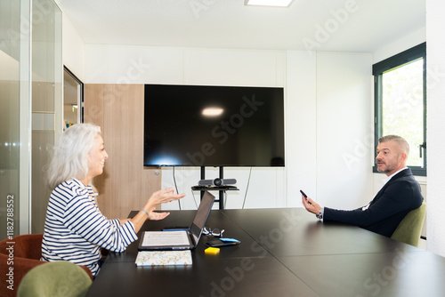 Informal Discussion Between Colleagues In Office Meeting. photo