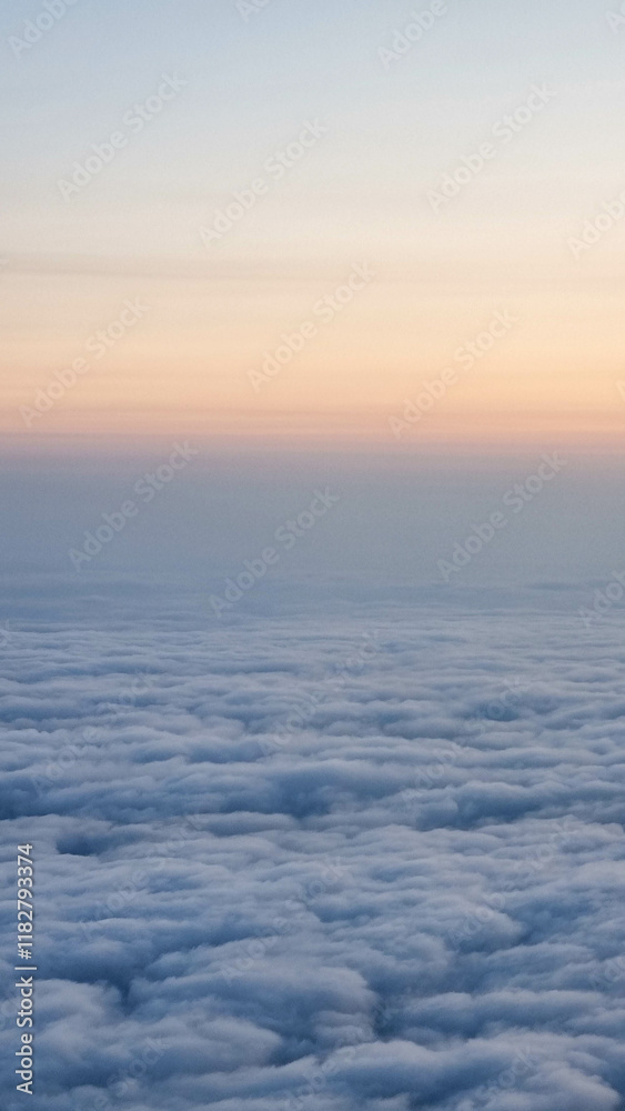 Beautiful sunset sky above clouds with dramatic light. Cabin view from airplane Beautiful sunset sky above clouds with dramatic light. Cabin view from airplane