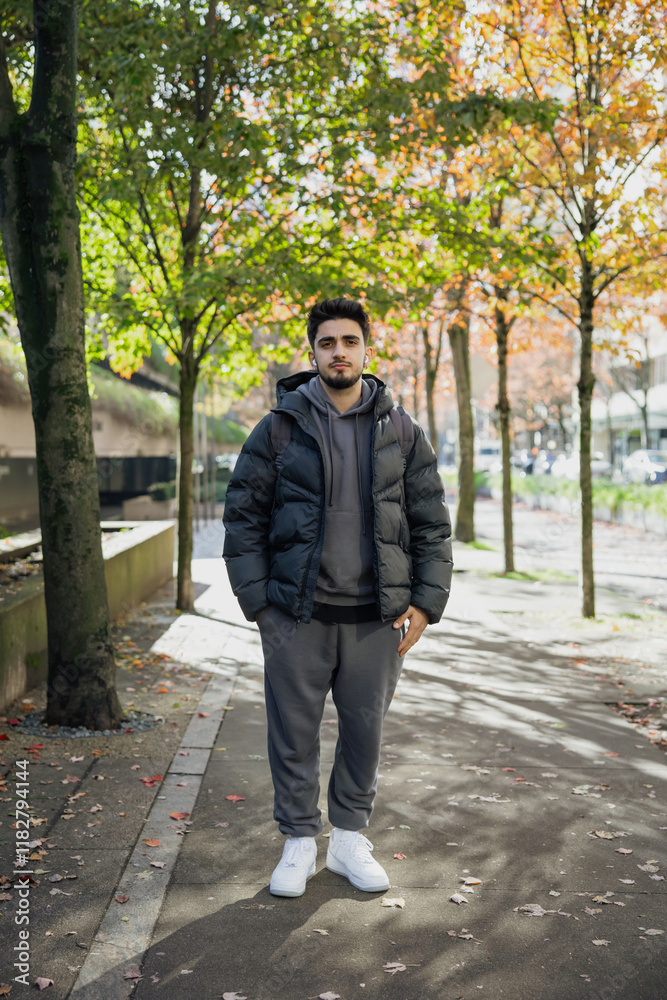 Young Man in Urban Park During Autumn Season Young Man in Urban Park During Autumn Season