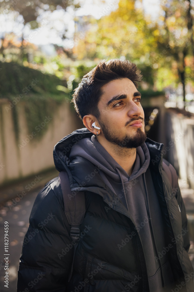 Young Man Enjoying Nature Walk on a Sunny Autumn Day Young Man Enjoying Nature Walk on a Sunny Autumn Day