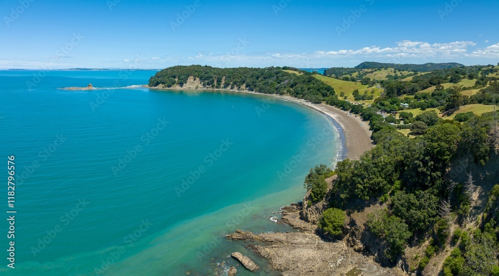 Stunning aerial view of a picturesque beach. People relax on the sandy shore, surrounded by lush greenery and a vibrant turquoise sea. Mahurangi West, Warkworth, Auckland, New Zealand Stunning aerial view of a picturesque beach. People relax on the sandy shore, surrounded by lush greenery and a vibrant turquoise sea. Mahurangi West, Warkworth, Auckland, New Zealand