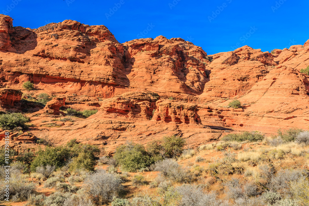 Fototapeta premium A rocky mountain range with a blue sky in the background
