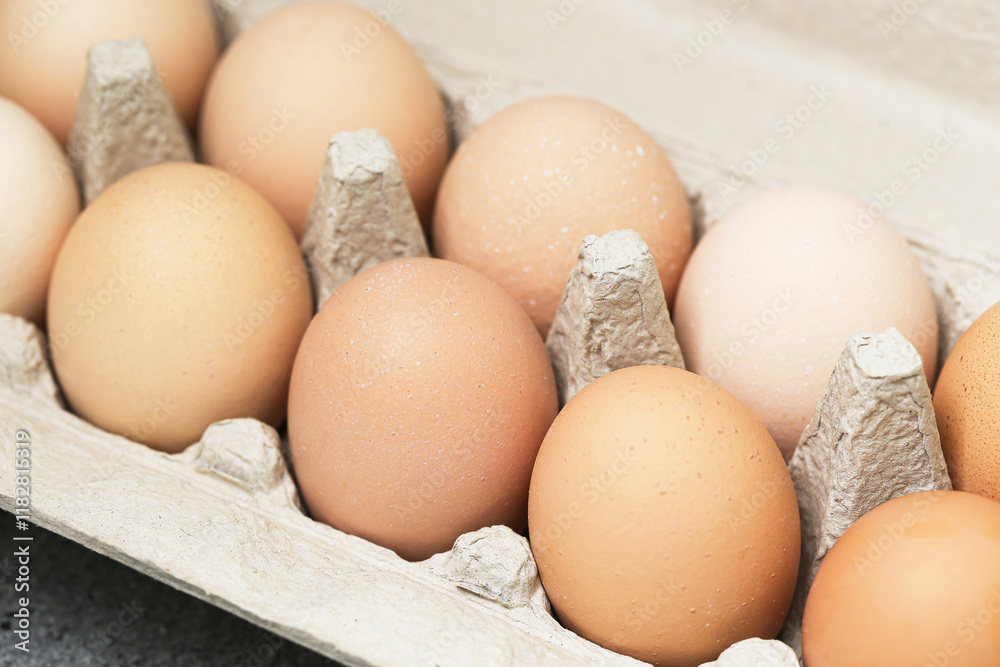 Farm fresh eggs in a carton. Closeup of rustic chicken eggs in a tray. Natural countryside food background. Eating fresh from ecological farmland. Farm fresh eggs in a carton. Closeup of rustic chicken eggs in a tray. Natural countryside food background. Eating fresh from ecological farmland.