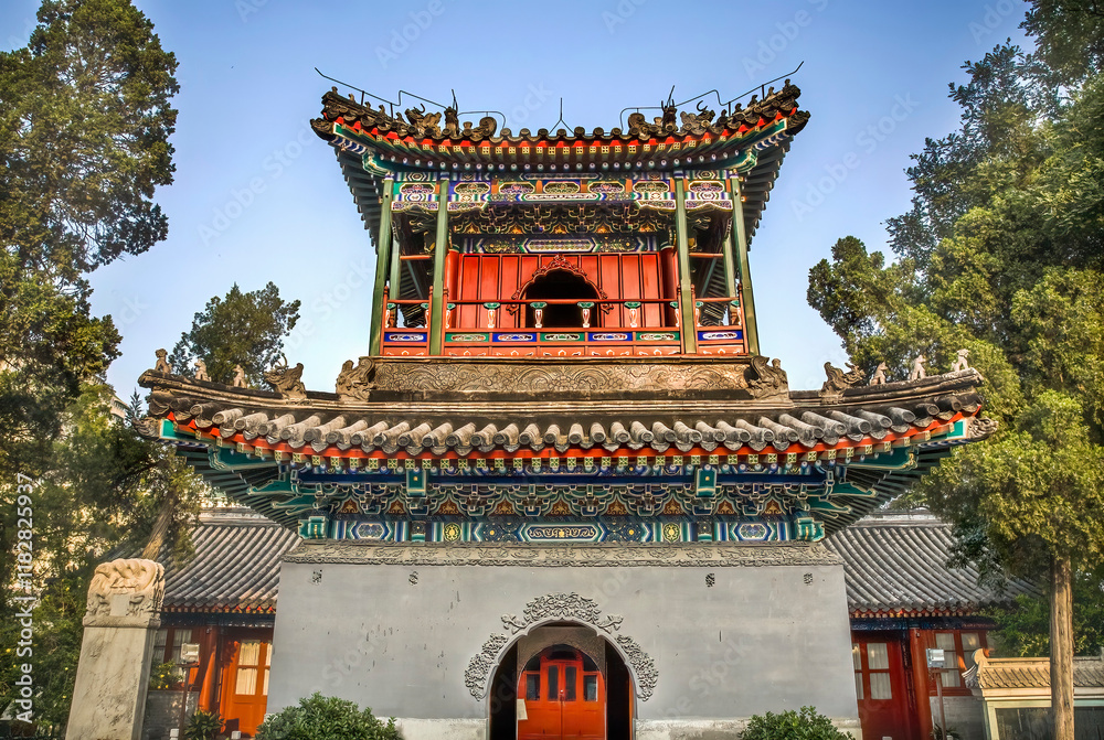 Fototapeta premium Chinese minaret tower and grave, Cow Street Mosque, Beijing, China. For the Hui minority, famous Muslim mosque in China