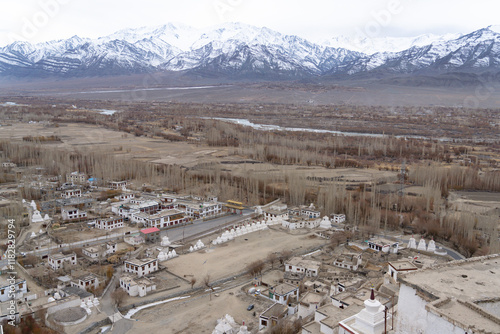 India, Ladakh, Indus Valley, Thiksey, Thiksey Monastery. View of the Indus Valley and the buildings at the base of the monastery. photo