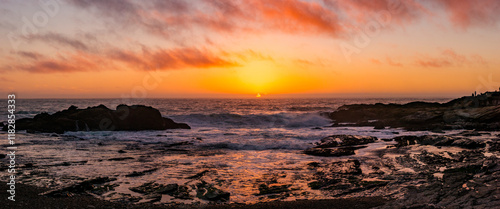 Weston Beach Panoramic Sunset with sun on the horizon. Pink clouds on yellow sky. photo